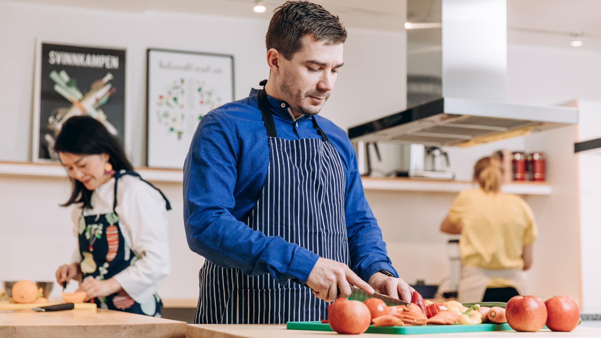 Man chopping vegetables in the kitchen