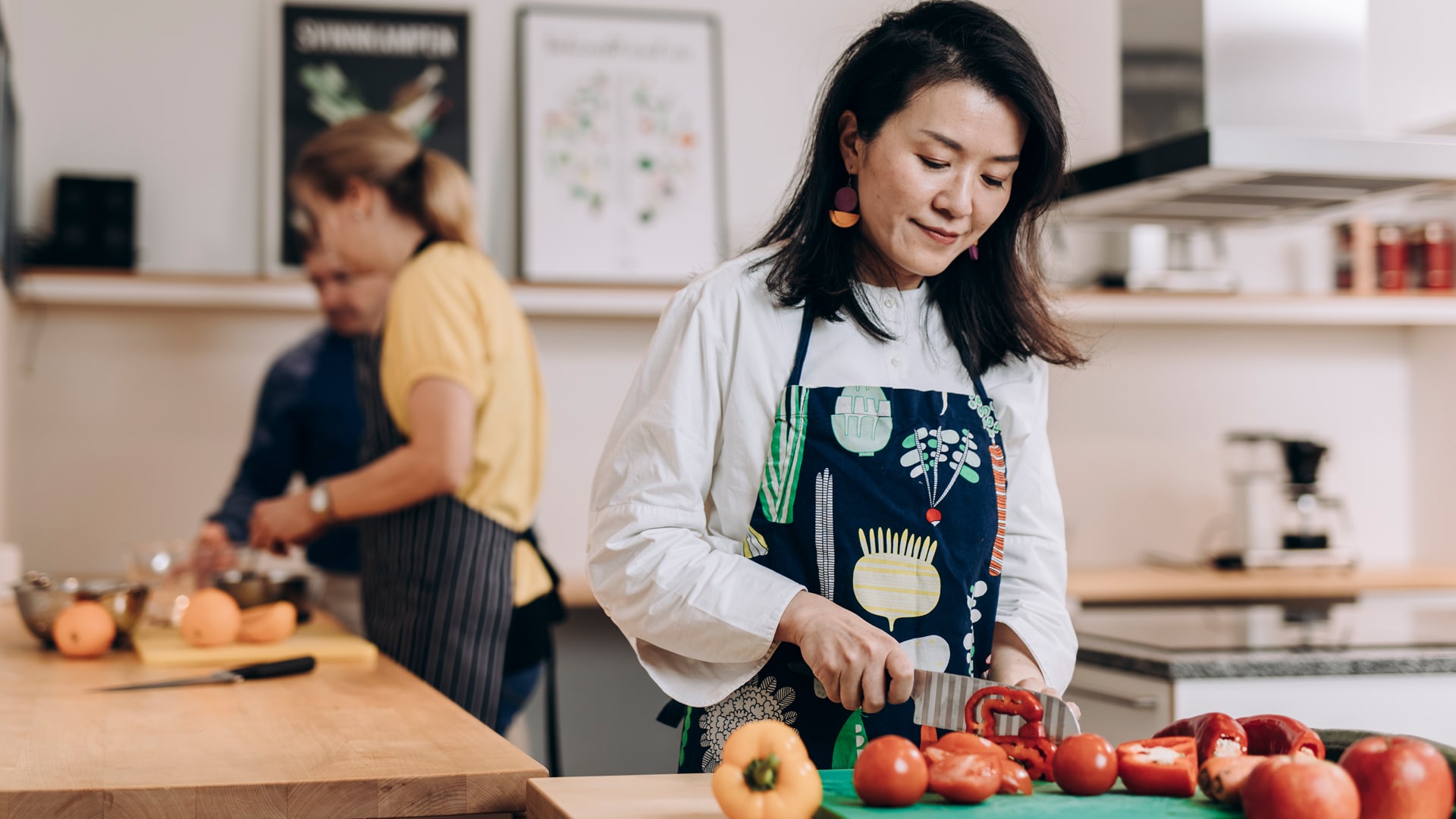 Woman chopping vegetables in a kitchen